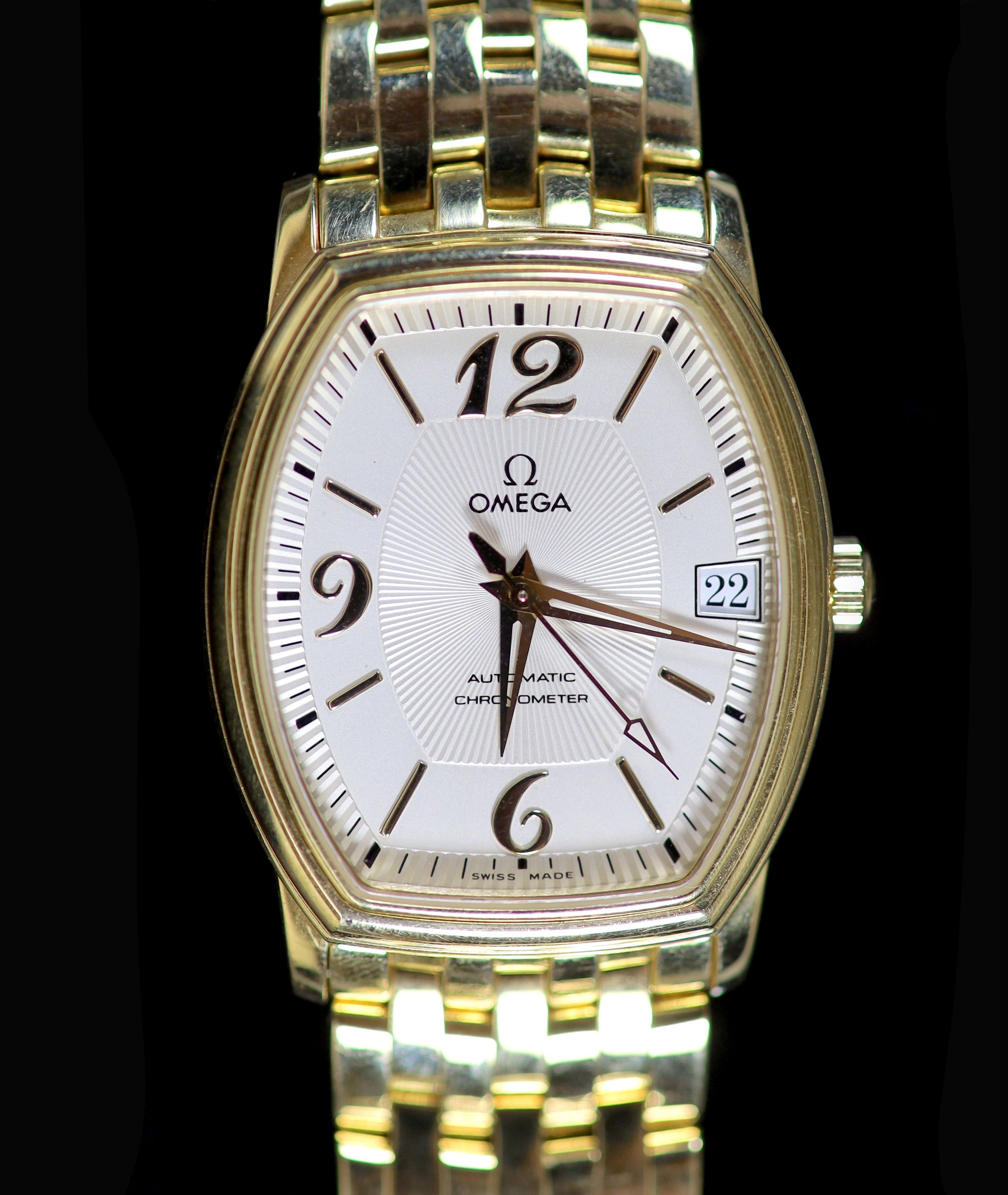 A gentleman's 18ct gold Omega Automatic Chronograph wrist watch, on an 18ct gold Omega bracelet